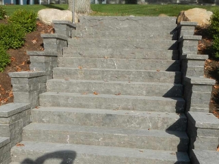 twelve stone stairs leading to a yard