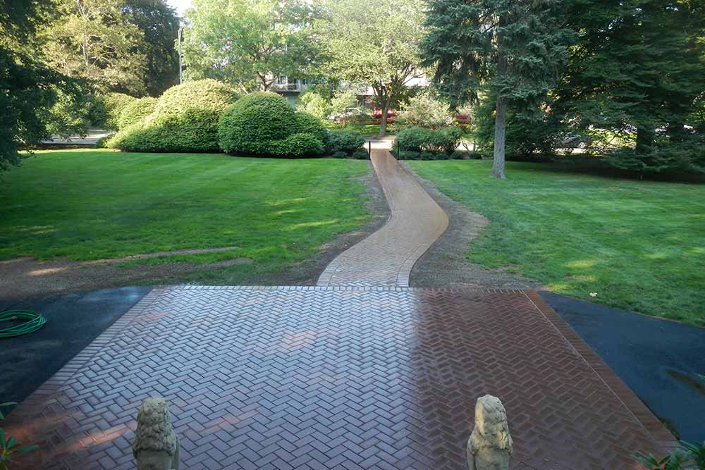 brick patio with brick walkway in yard