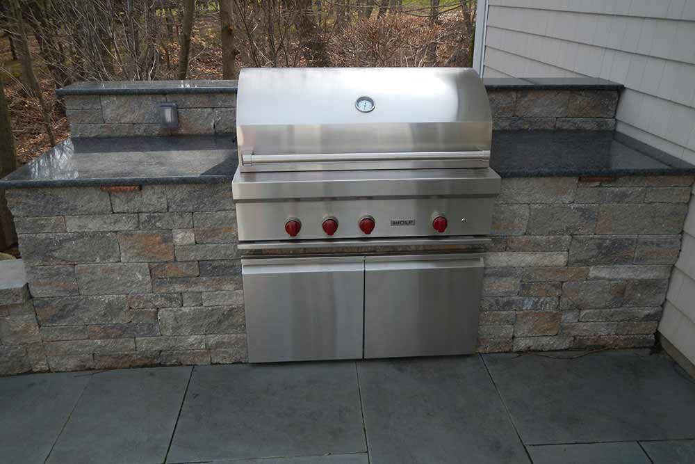 close up of grill built in to stone wall