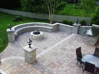 backyard with stone patio and outdoor furniture